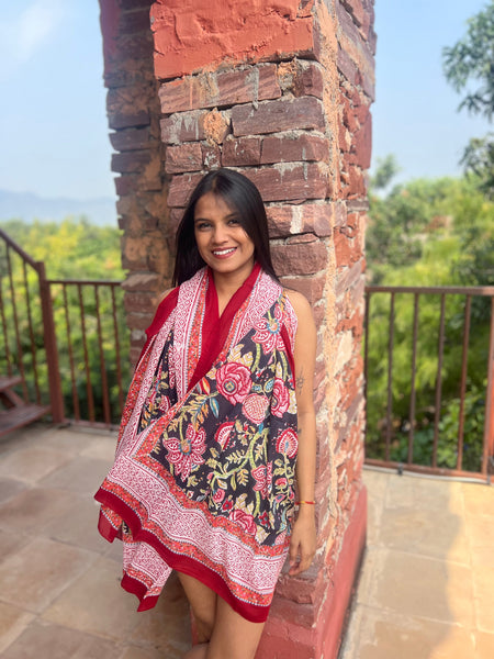 Medianoche sarong, black and red floral print, draped as a wrap — Aurobelle Ibiza