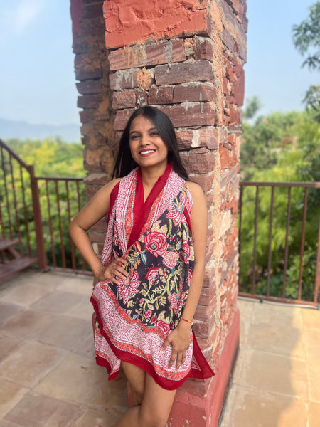 Medianoche sarong, black and red floral print, styled as a beach wrap — Aurobelle Ibiza