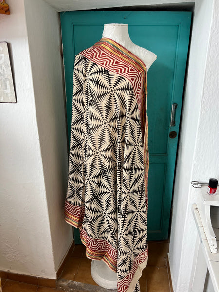 Aurobelle Ibiza black abstract sarong draped as a wrap, organic muslin cotton