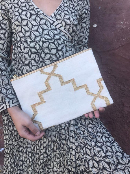 Contemporary handwoven dhurrie boho clutch with golden leather tassel -  AUROBELLE  IBIZA