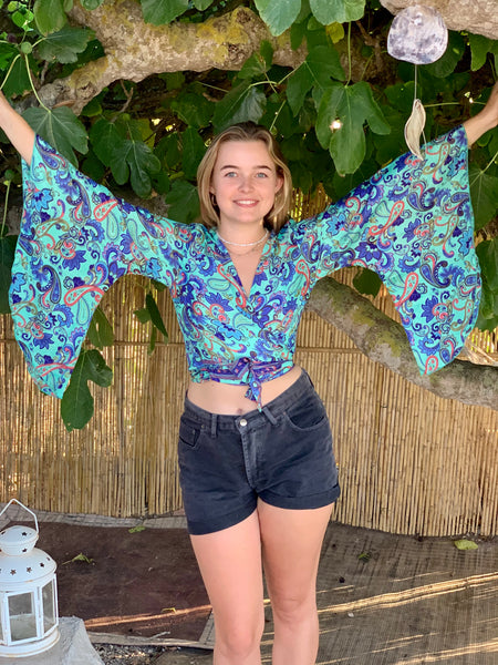 Wrap blouse in silky happy prints